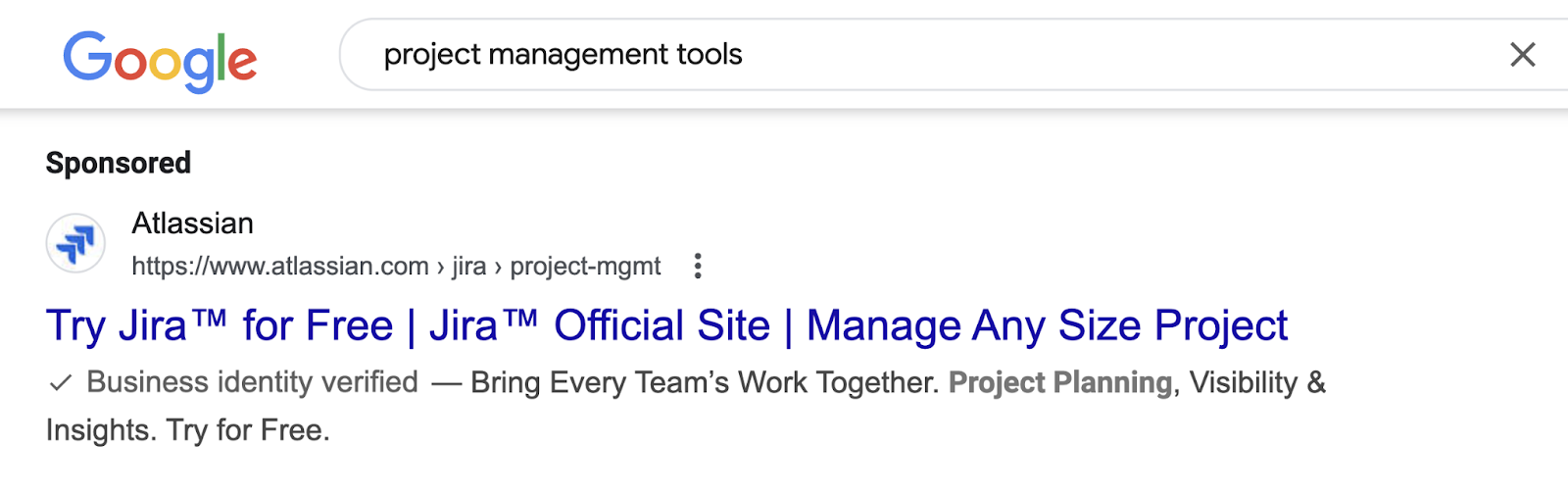 At the top of the SERP for a query, a sponsored label with a listing appears.